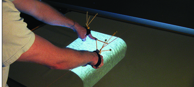 Teaser image for Nailing Down Multi-Touch: Anchored Above the Surface Interaction for 3D Modeling and Navigation